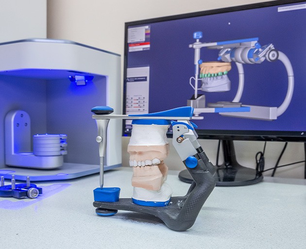 A dental technician crafting custom dentures in a lab