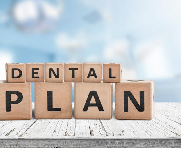 Blocks spell “dental plan”