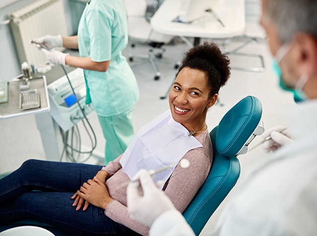 Female patient talking with dentist