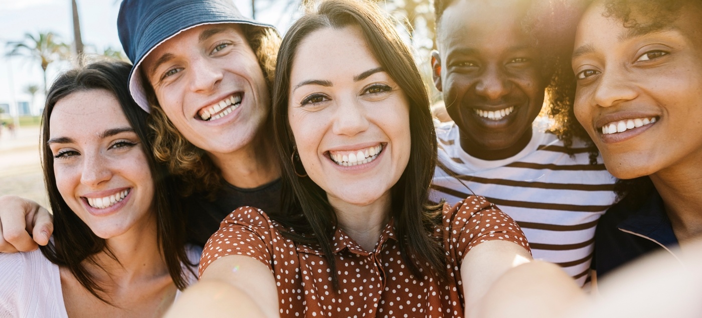 Group of adults taking selfie together