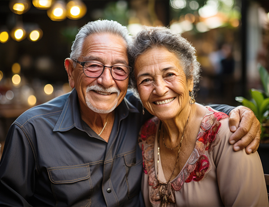 Senior man and woman hugging in a restaurant