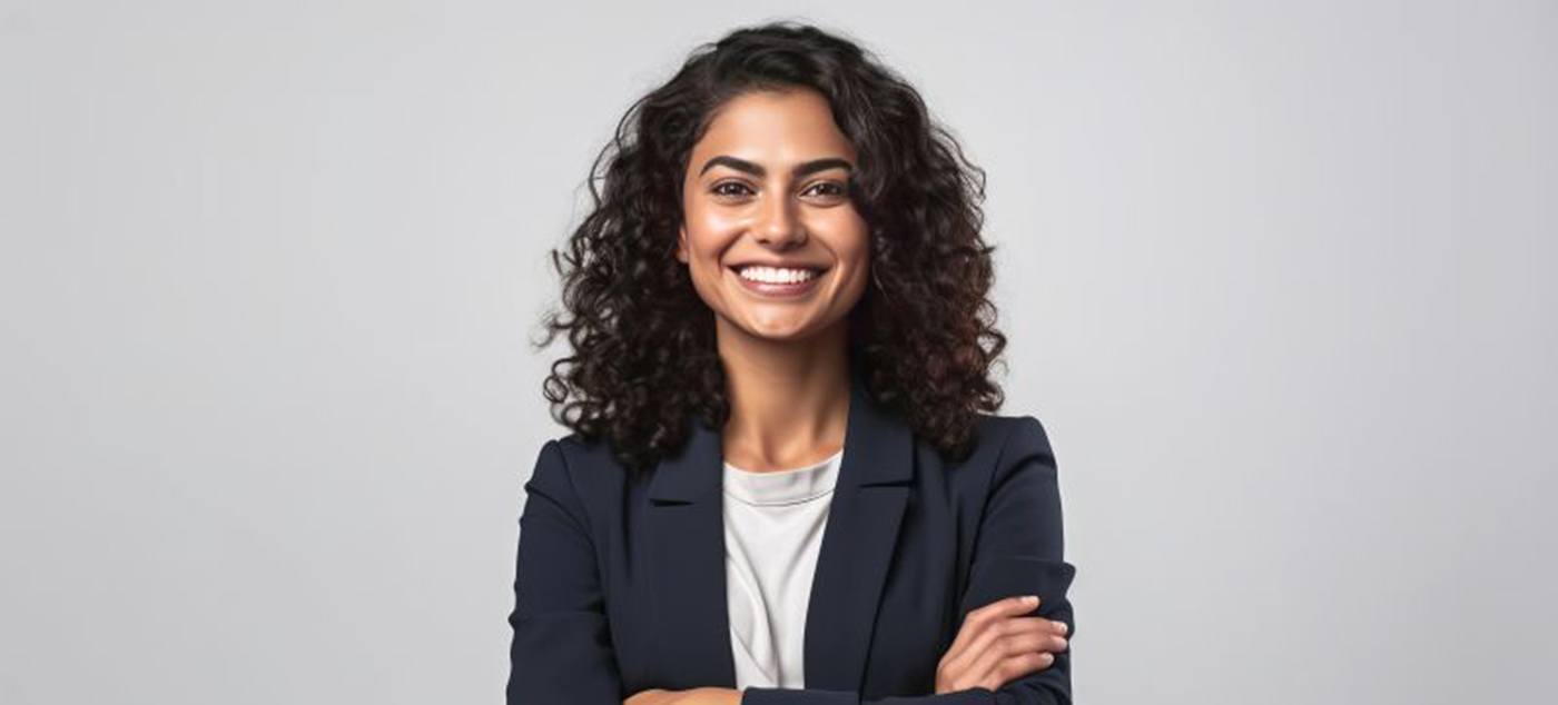 Woman holding her hands in heart shape to frame her smile