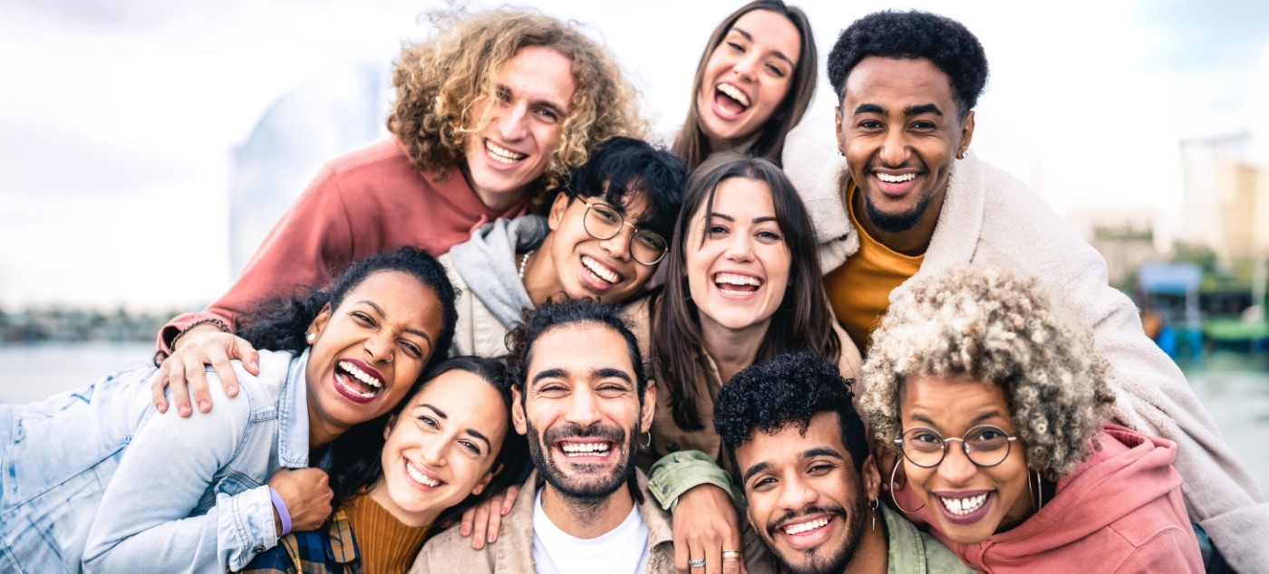 Large group of adults smiling together