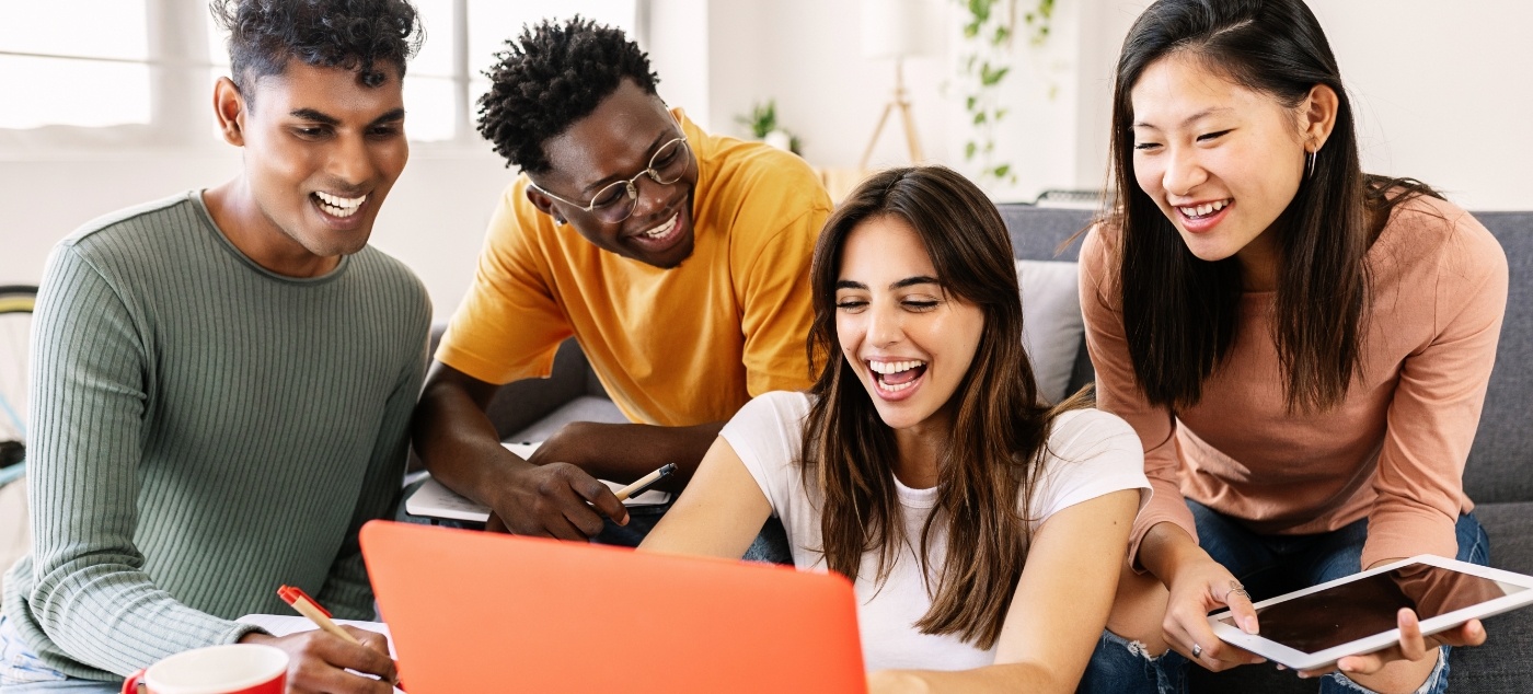 Group of people looking at laptop for dentist reviews in Dublin