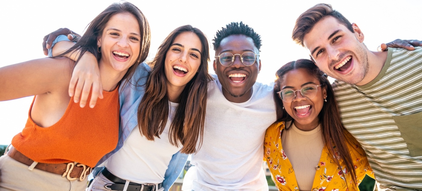 Several teenagers smiling outdoors after wisdom tooth extractions in Dublin